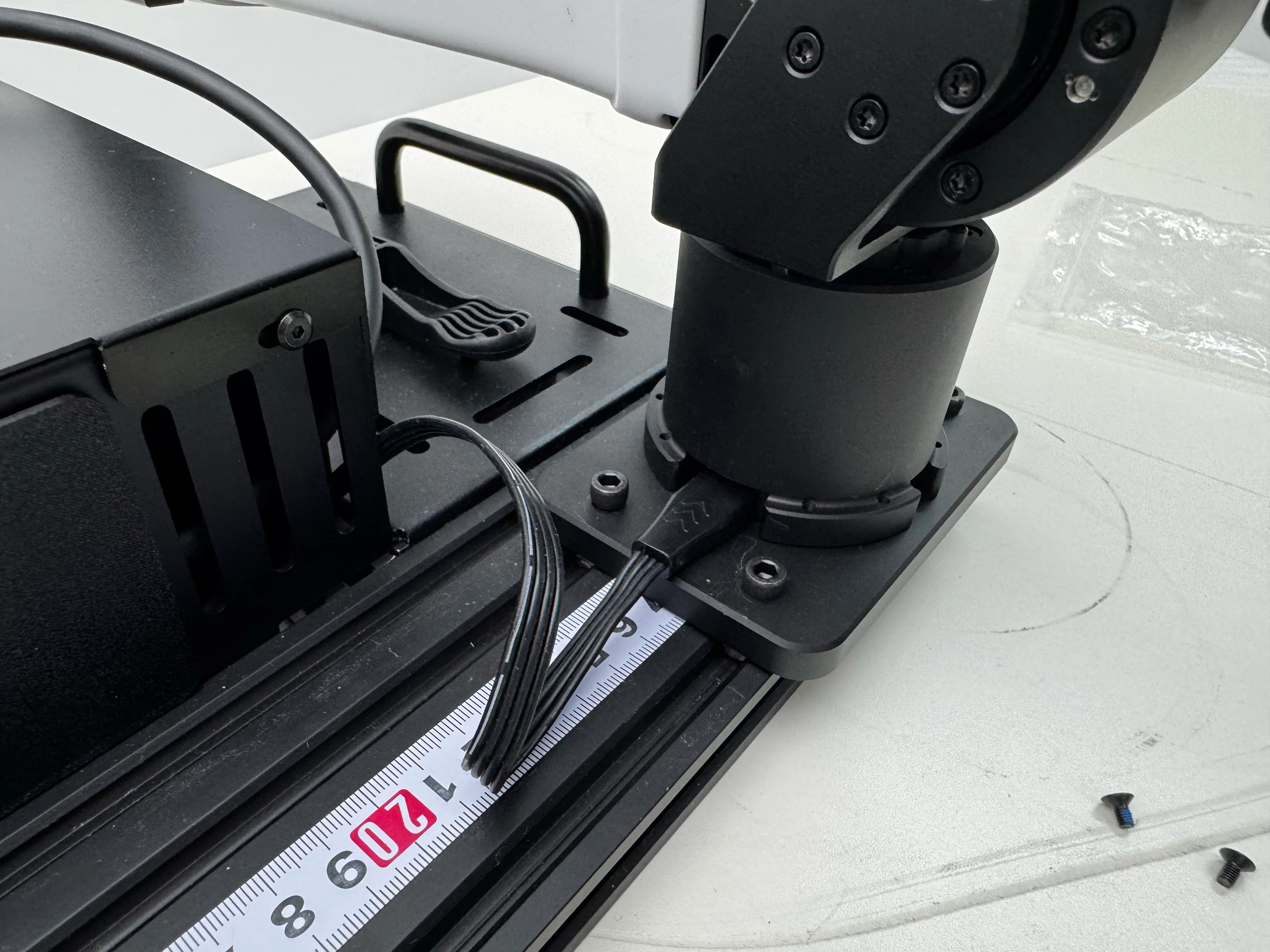 Step 6: Attach camera brackets to arms